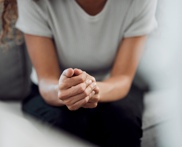 Cropped shot of an unrecognisable woman sitting alone and feeling anxious during her consultation Trauma Treatment in Orange County